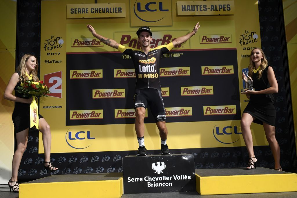 Former ski jumper Primoz Roglic sticks the landing on the podium after winning stage 17 of the Tour de France.