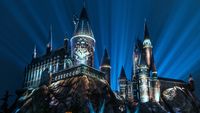 Hogwarts lit up with the nighttime lights at Universal Orlando. 