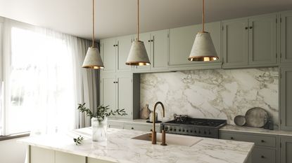 An image of a olive green, marble and gold kitchen with olive cabinets, marble countertops and splashback and gold accents