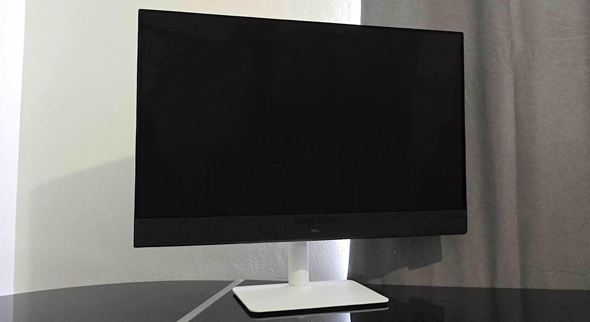 The Dell S3225QC monitor at an angle on a desk