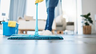 woman mopping floor