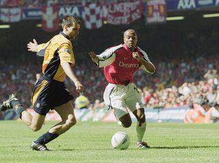 12 May 2001: Sylvain Wiltord of Arsenal tries to take the ball past Markus Babbel of Liverpool during the AXA sponsored FA Cup Final played at the Millennium Stadium, in Cardiff, Wales. Liverpool won the match and cup 2-1. \ Mandatory Credit: Clive Brunskill /Allsport