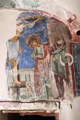 Scene of the Crucifixion on the south wall of the Cell inside the Byzantine monastery, painted over a thin layer of lead white applied as an intermediate layer to mask a preexisting painting.