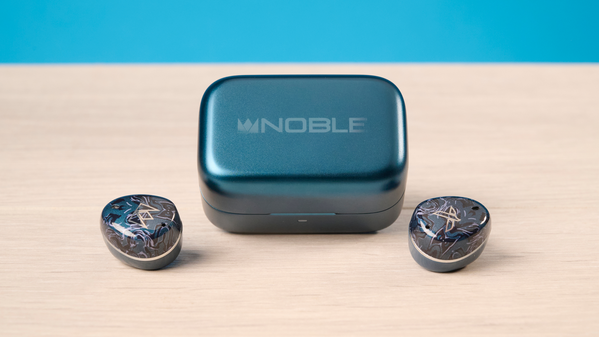 A pair of Noble Audio Osprey wireless earbuds