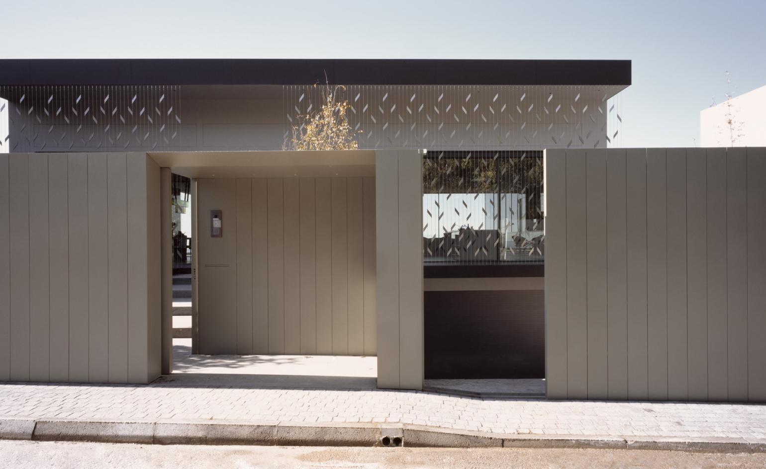 Entrance from the street side at reflection house in Athens
