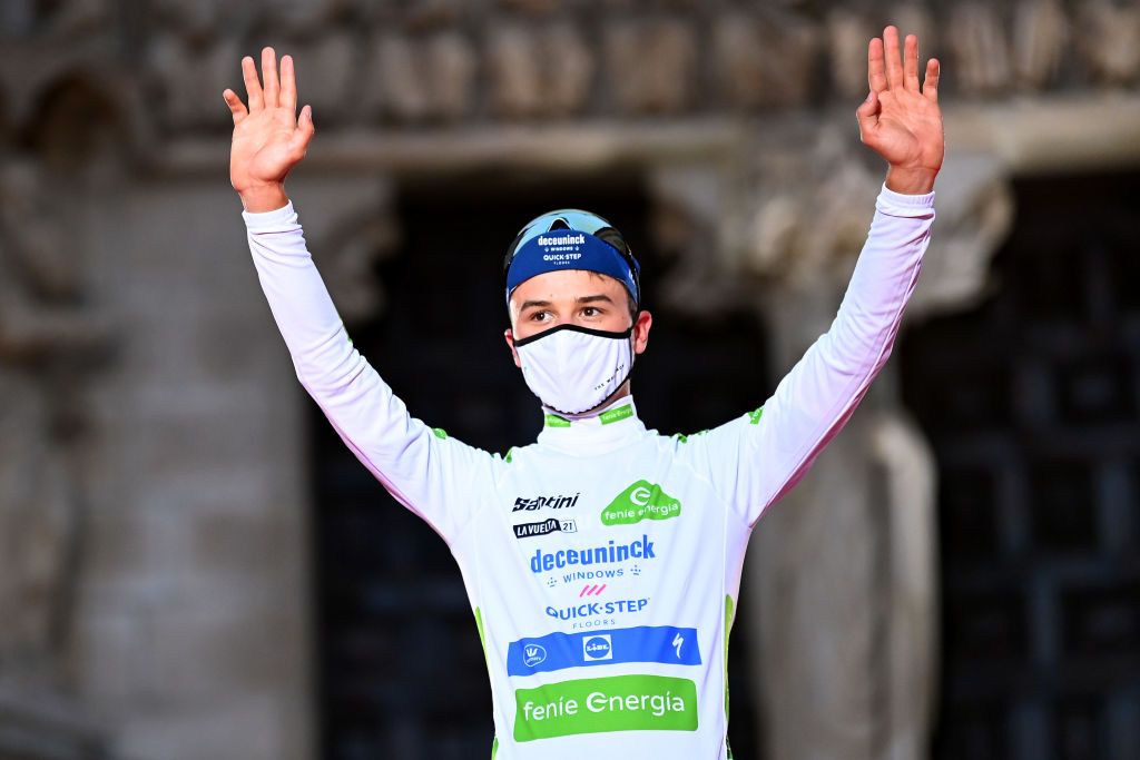 BURGOS SPAIN AUGUST 14 Andrea Bagioli of Italy and Team Deceuninck QuickStep celebrates winning the white best young jersey on the podium ceremony after the 76th Tour of Spain 2021 Stage 1 a 71km individual time trial from Burgos Catedral de Santa Mara to Burgos lavuelta LaVuelta21 CapitalMundialdelCiclismo catedral2021 on August 14 2021 in Burgos Spain Photo by Stuart FranklinGetty Images
