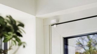 Eve Door and Window Sensor installed above a door