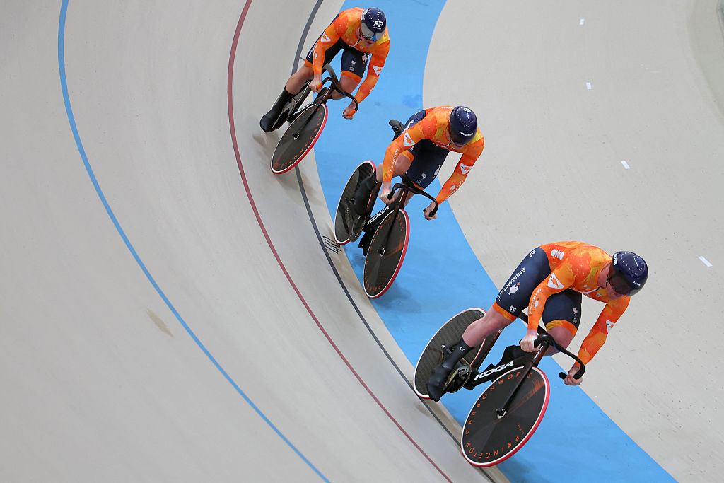 Netherlands&#039; Jeffrey Hoogland, Harrie Lavreysen and Roy Van den Berg compete in the men&#039;s team sprint qualifying during the 2025 UCI Track World Championships at the Pe&amp;ntilde;alolen Velodrome, in Santiago, on October 22, 2025. (Photo by Javier TORRES / AFP)