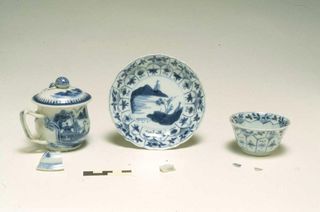 The scientists found bits of Chinese porcelain (shown at front), with a reconstruction of what they would've looked like if intact.
