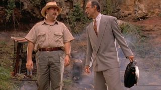 Miguel Sandoval and Martin Ferrero talking in front of an amber mine in Jurassic Park.