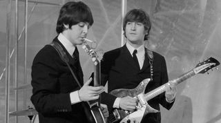 Musicians John Lennon (R) and Paul McCartney of English rock group The Beatles on the set of television special The Music of Lennon & McCartney at Granada Studios, Manchester, circa November 1965. 