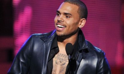 Chris Brown accepts the Grammy award for Best R&B Album last Sunday: Brown followed his win with a Twitter tirade calling out all his haters only to gain more.
