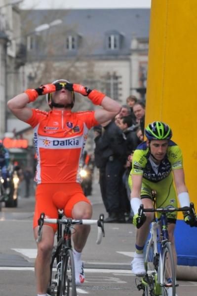 A disappointed Bideau looks down as Pineau celebrates.