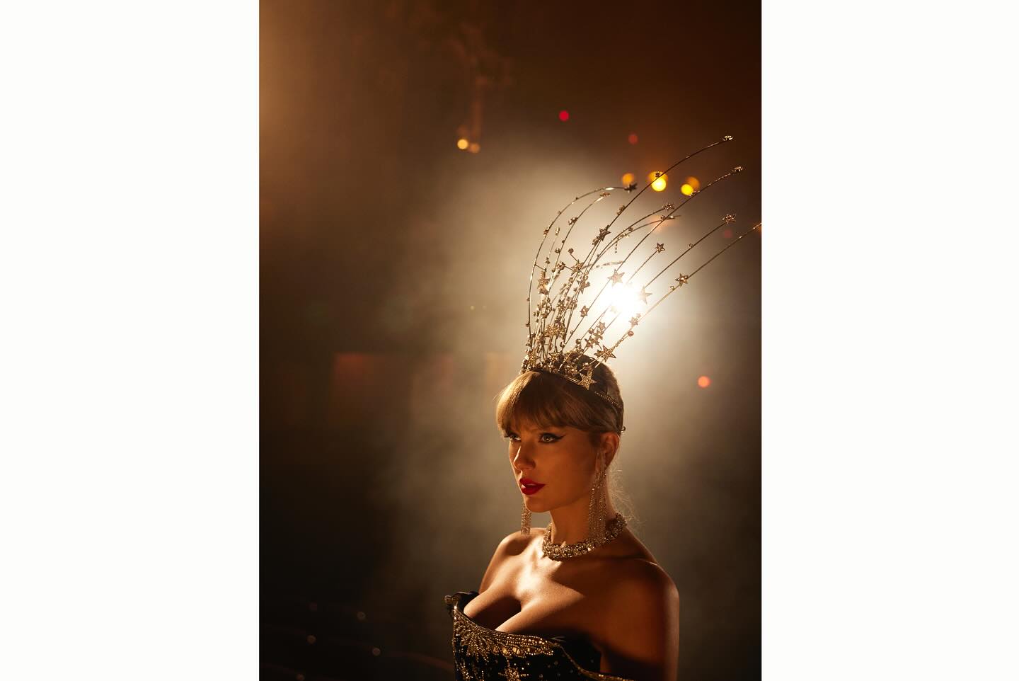 Taylor Swift on a stage wearing a star headdress and an Annie&#039;s Ibiza dress