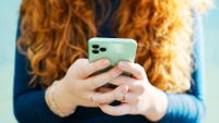 A woman holding a smartphone