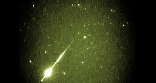 This image is a false-color video still from the 2002 Leonid meteor shower, seen through a camera operated by the NASA Meteoroid Environment Office at Marshall Space Flight Center.