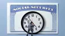 A man holds back the hands of a clock on a large clock that stands in front of a large Social Security card