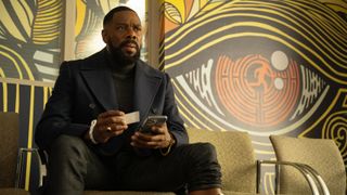 Muncie (Colman Domingo) sits in a waiting room in Netflix's "The Madness"