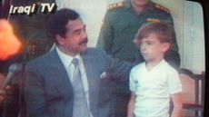 Image from Iraqi TV showing Saddam Hussein with one of the British hostages, six-year-old Stuart Lockwood
