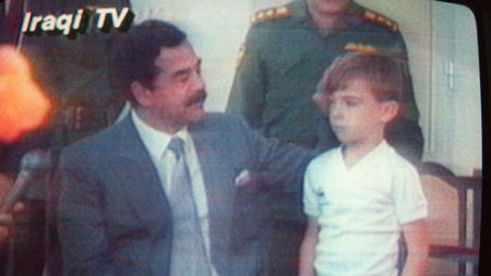 Image from Iraqi TV showing Saddam Hussein with one of the British hostages, six-year-old Stuart Lockwood