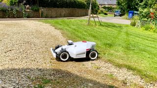 Mammotion LUBA 2 AWD on a gravel driveway