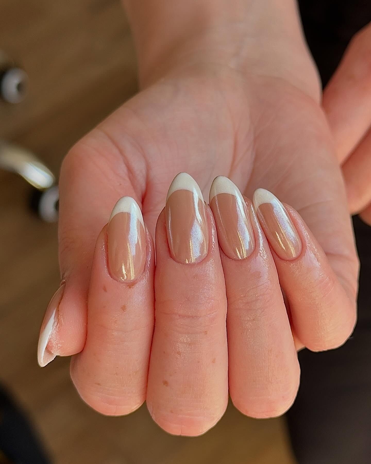 A person with glazed French tips.