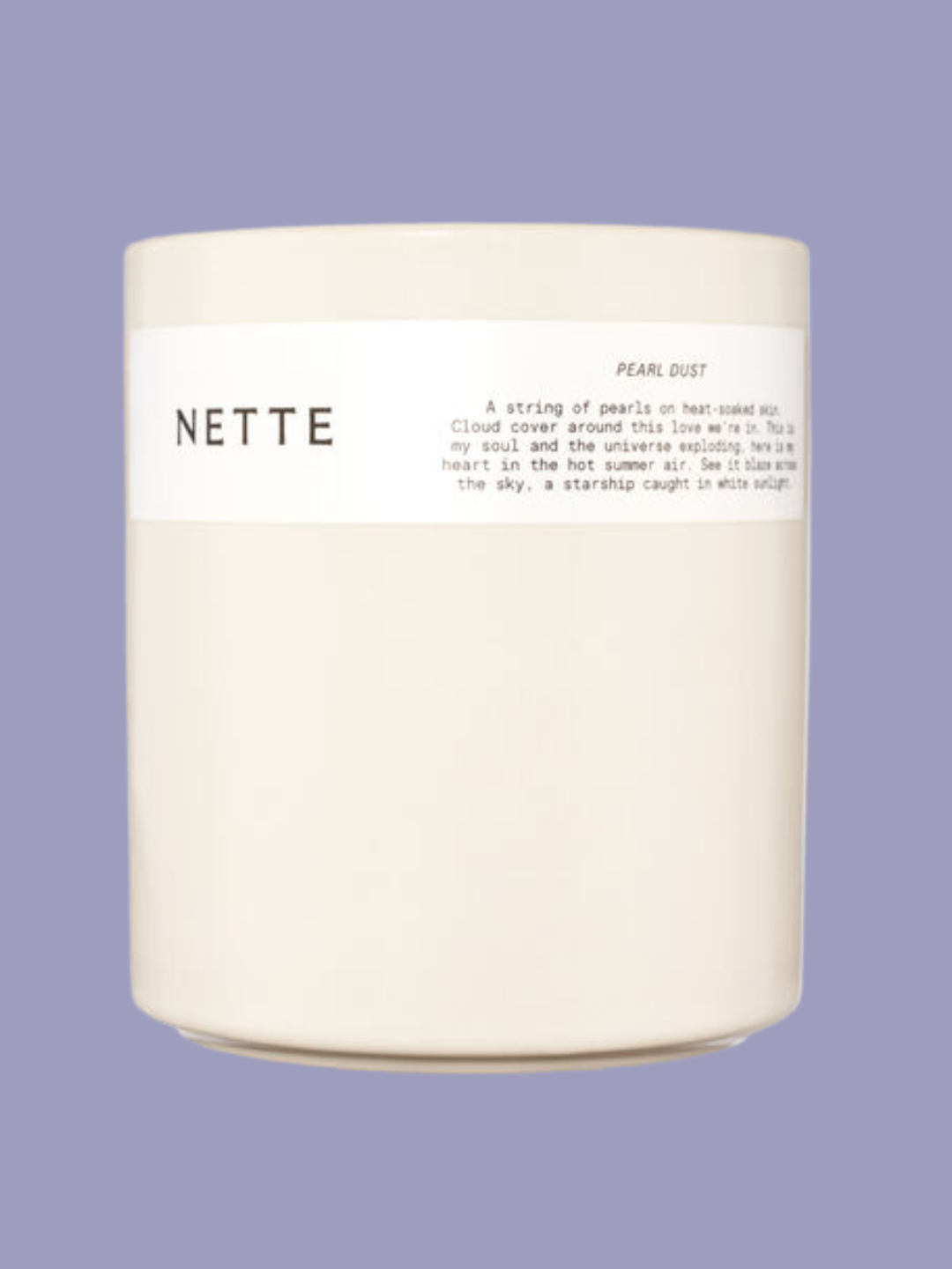 A glossy white pearl dust scented candle from Nette NYC