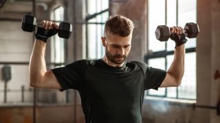'Stop doing overhead presses until you fix these 3 huge mistakes,' says a personal trainer