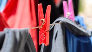 I had no idea clothespins had a hidden feature &mdash; here's what the two holes are actually for