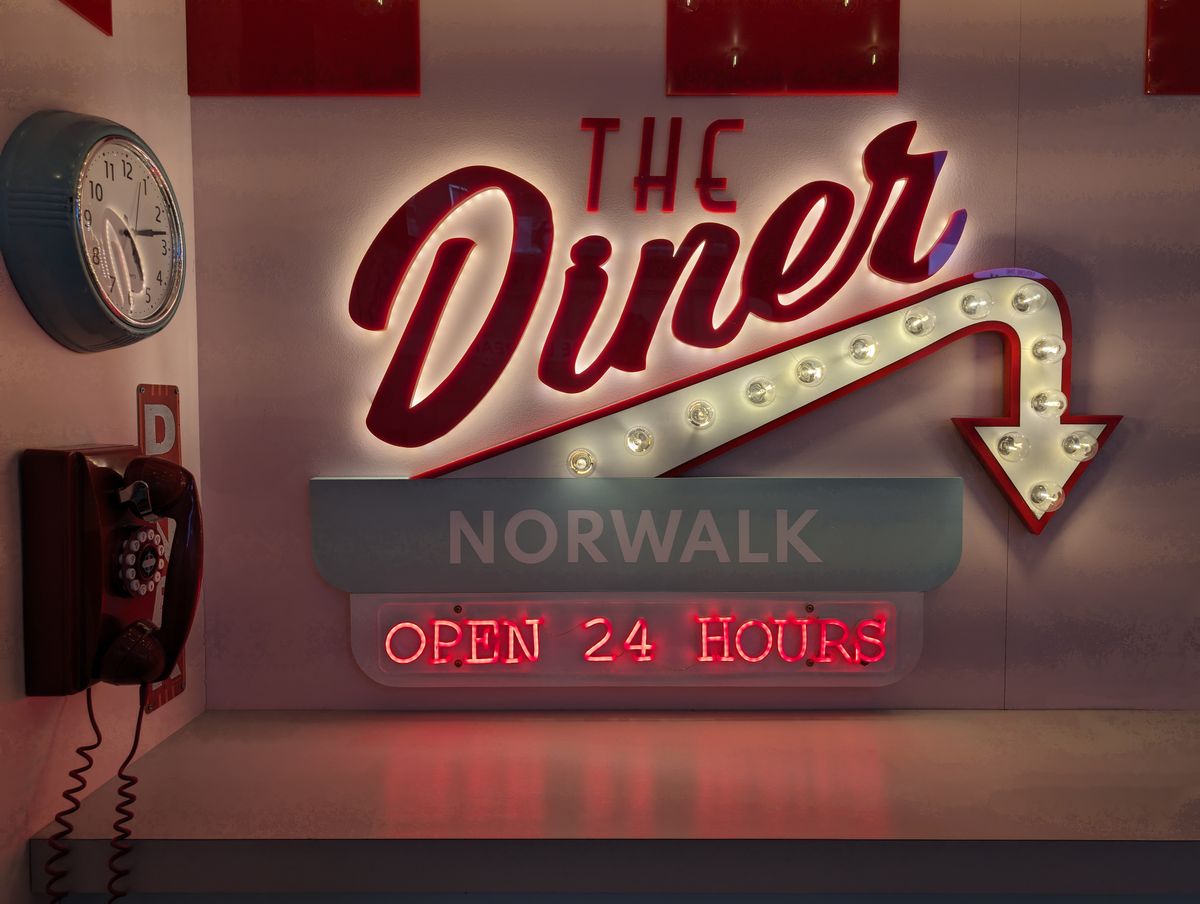 Google Pixel 8a camera sample showing a Diner sign Open 24 hours