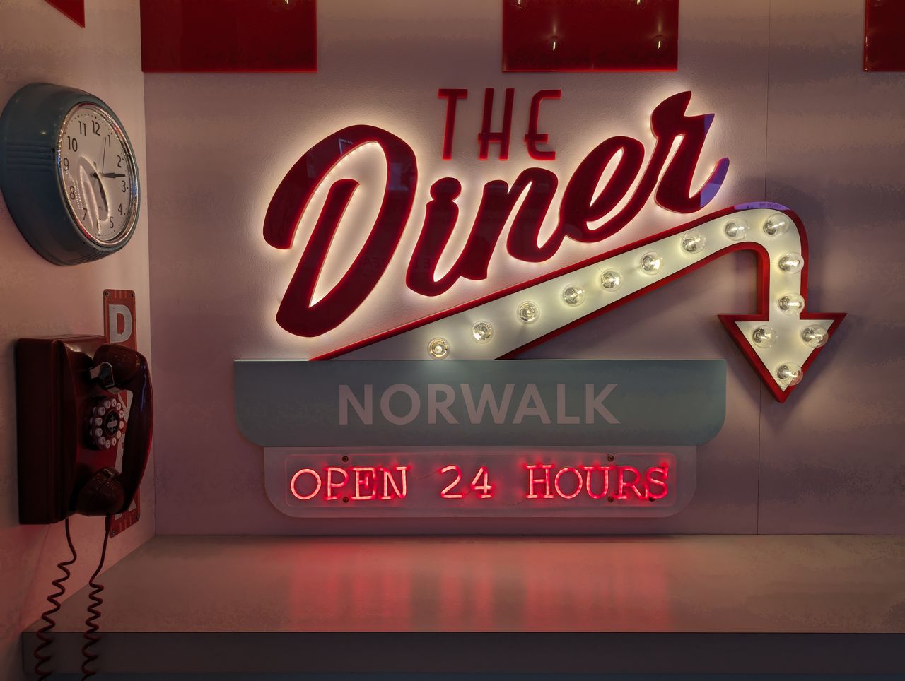 Google Pixel 8a camera sample showing a Diner sign Open 24 hours
