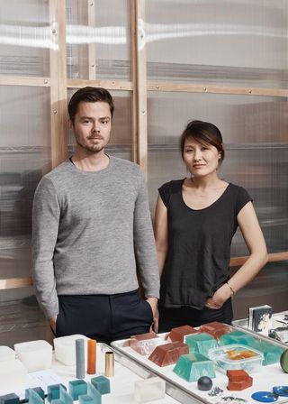 Oliver and Jean Pelle at their soap-making studio with pieces including the cylindrical and spherical forms from the ‘Rock Garden’ set.