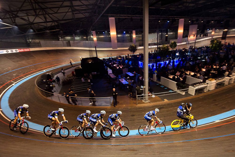 Riders are motorpaced on the track at the Etixx-QuickStep team presentation.
