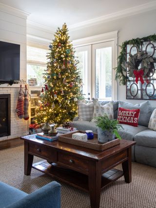 Living room with decorated and illuminated Christmas tree