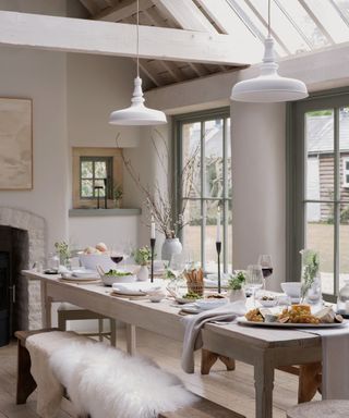 Cozy autumnal table with sheepskin throws