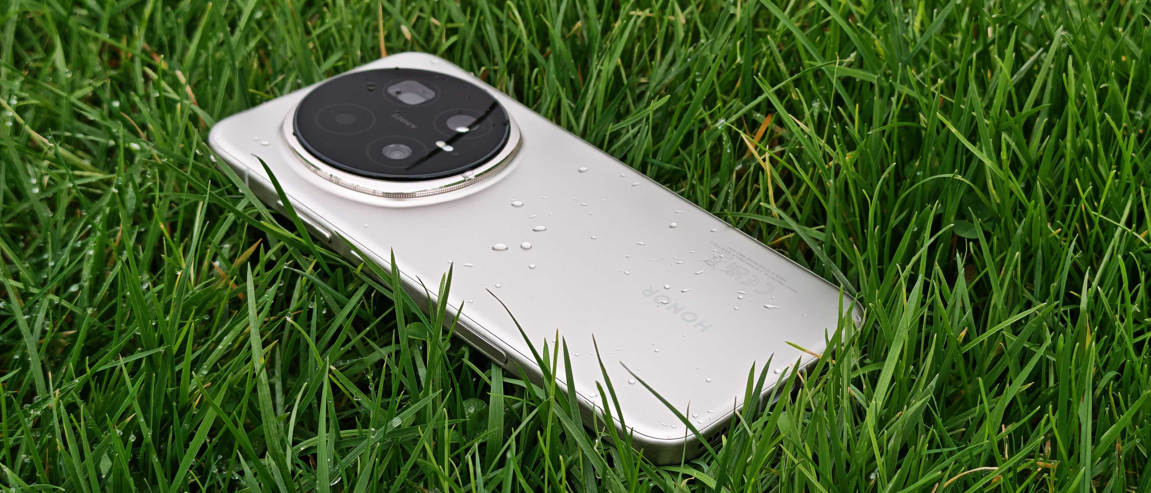 The Honor Magic 8 Pro lying in some wet grass