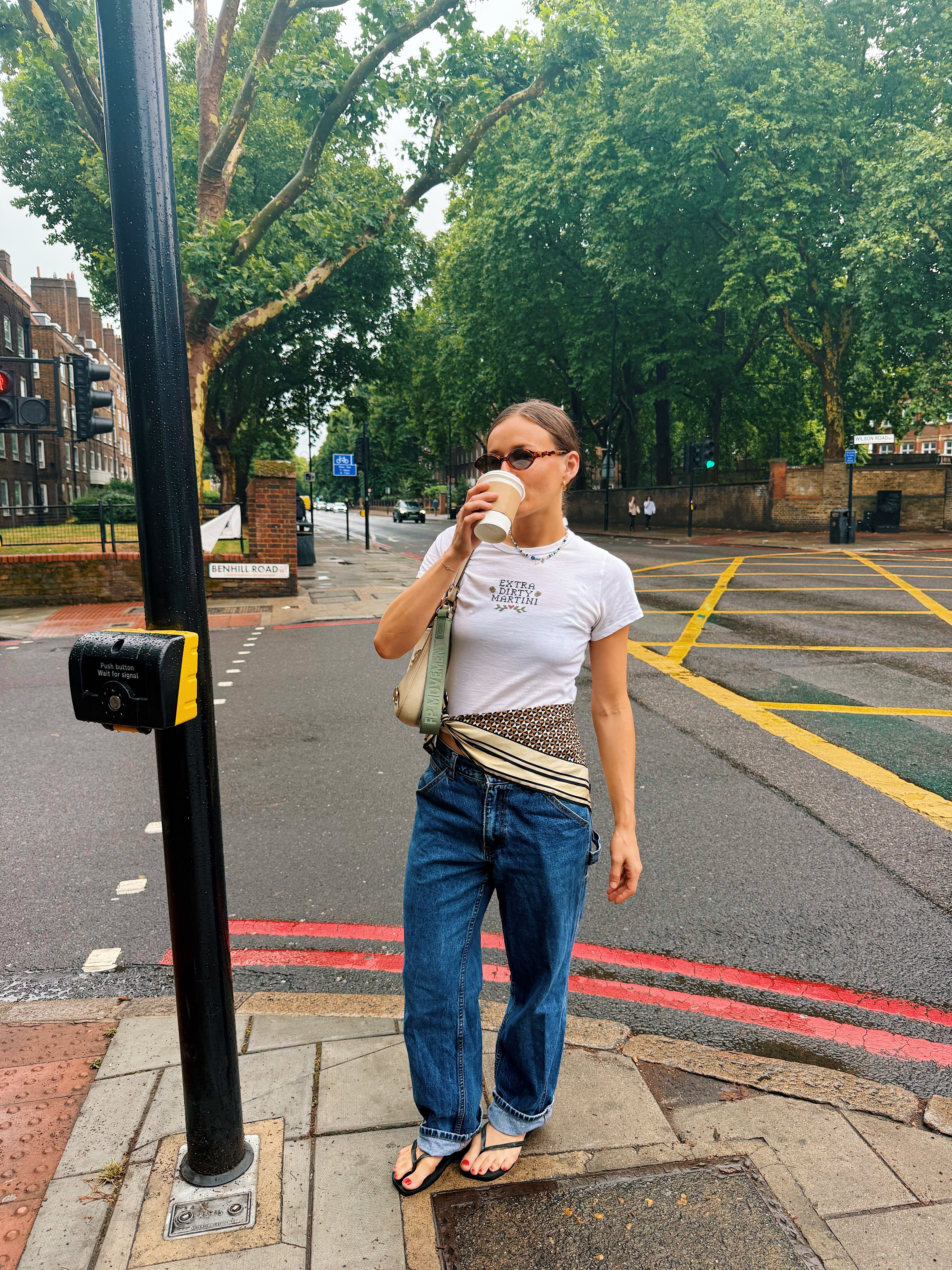 Ally head wears a silk scarf around her waist
