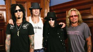Motley Crue standing at a photo call during a press conference in 2005