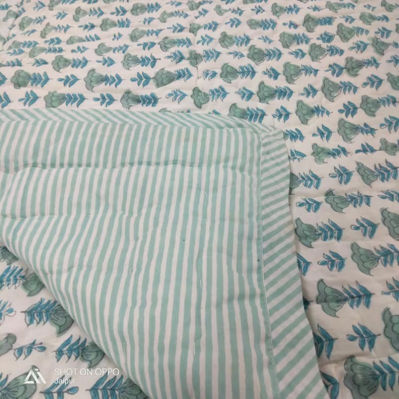 light blue patterned quilt