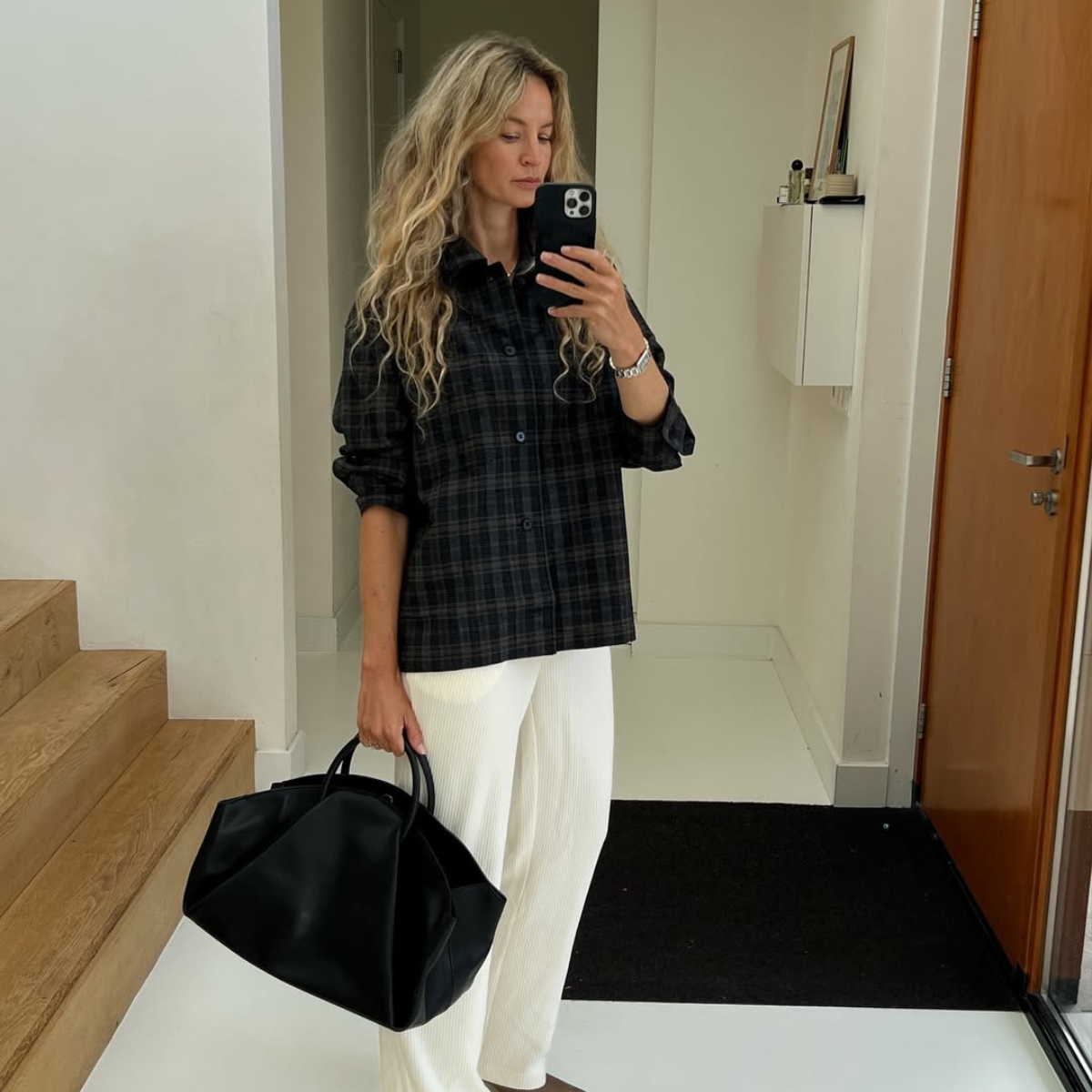 @anoukyve wears navy flannel shirt white trousers