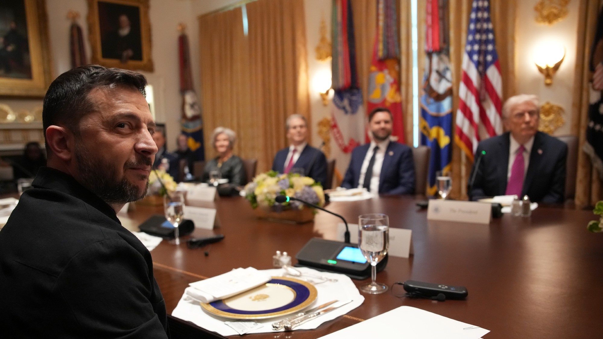 Volodymyr Zelenskyy looks on during a meeting with Donald Trump and members of his Cabinet at the White House