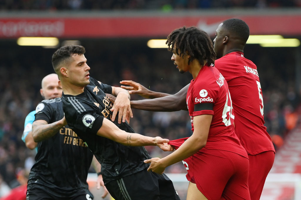 Granit Xhaka of Arsenal is confronted by Trent Alexander-Arnold and Ibrahima Konate of Liverpool during the Premier League match between Liverpool FC and Arsenal FC at Anfield on April 09, 2023 in Liverpool, England.