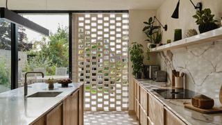 modern wooden kitchen with lattice effect window treatment