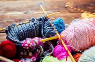 Balls of yarn and knitting needles