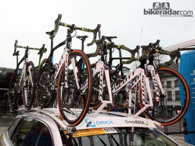 A fleet of Scott Foils sit atop the Orica-GreenEdge team car before the start of Ronde van Vlaanderen