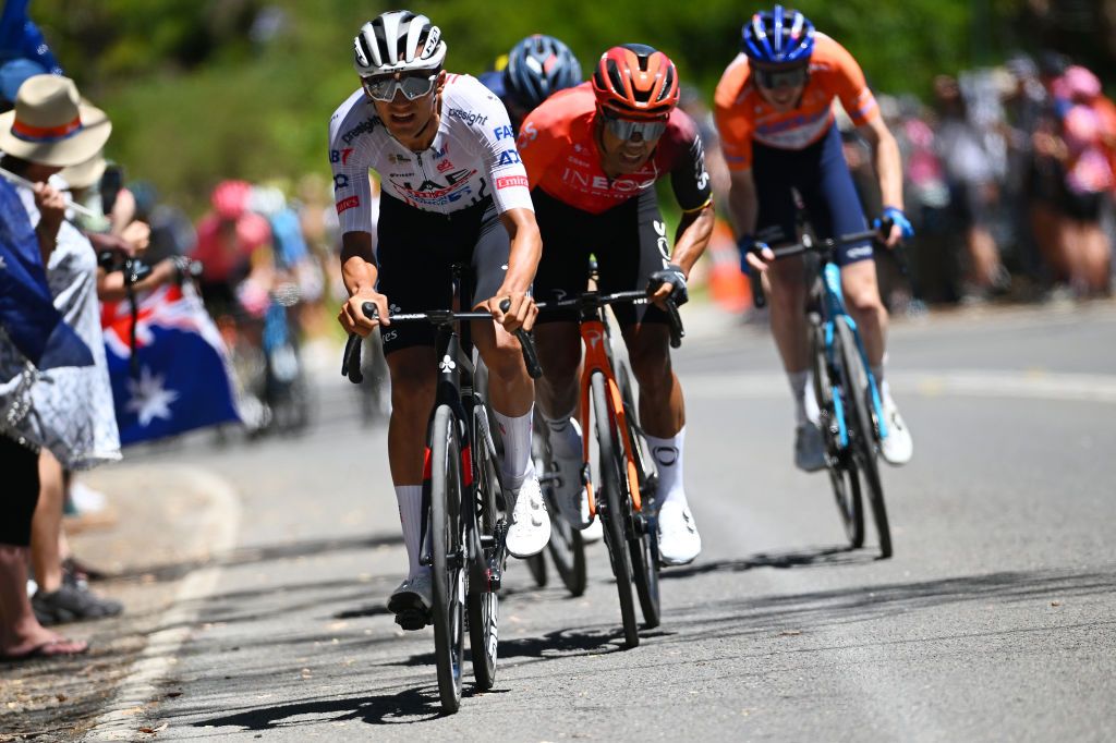 Isaac Del Toro (UAE Team Emirates) and Jhonatan Narvaez (Ineos Grenadiers) attack in the final climb Mt Lofty