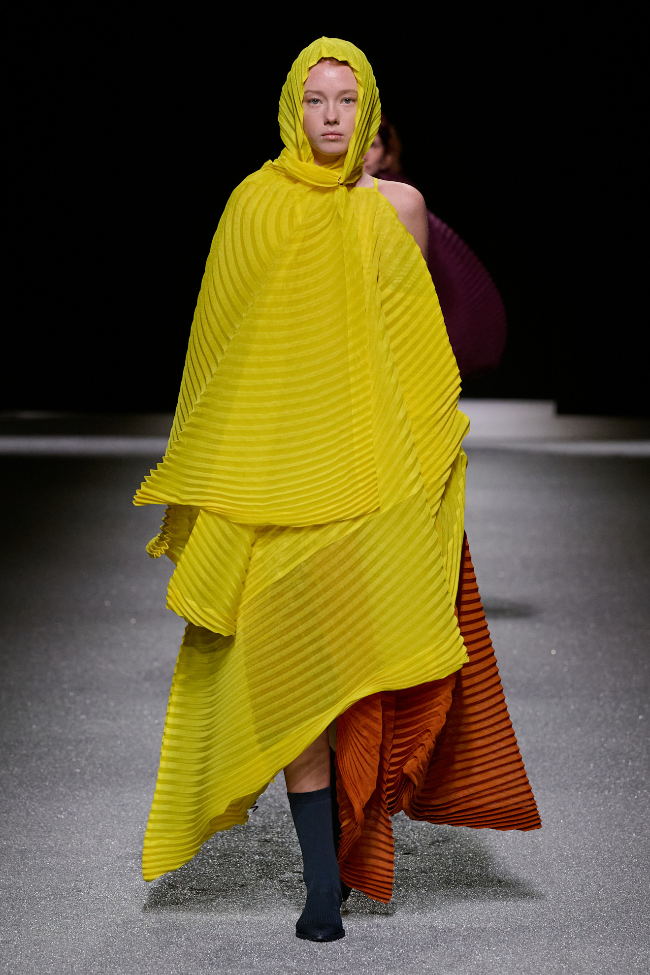 A model wore the acid yellow color trend on the Issey Miyake Fall 2026 runway