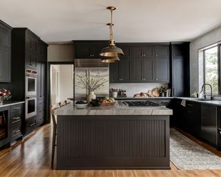 modern kitchen with dark brown cabinets and kitchen island