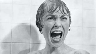 Vera Miles as Lila Crane screaming while in the shower during a scene in the movie Psycho.
