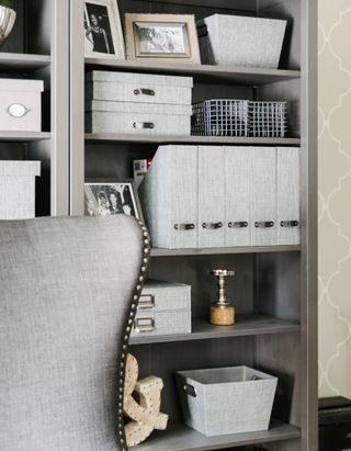 A well organized office with grey tones and accessories